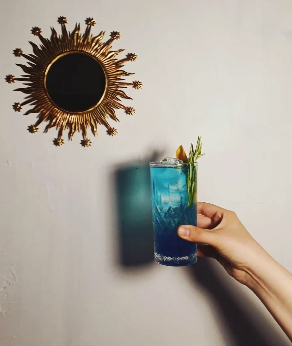 A blue cocktail catching the light