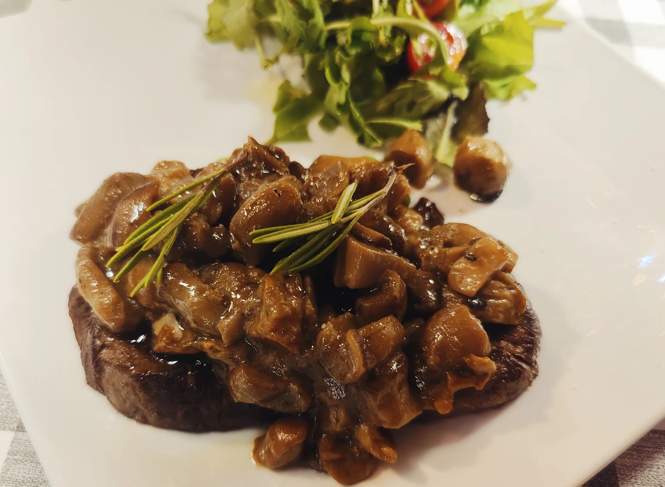 A braised meat dish with mushrooms